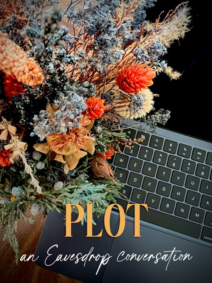 Colorful dried flowers are displayed next to a laptop keyboard to herald spring and inspiration. Text at the bottom says PLOT: An Eavesdrop Conversation.